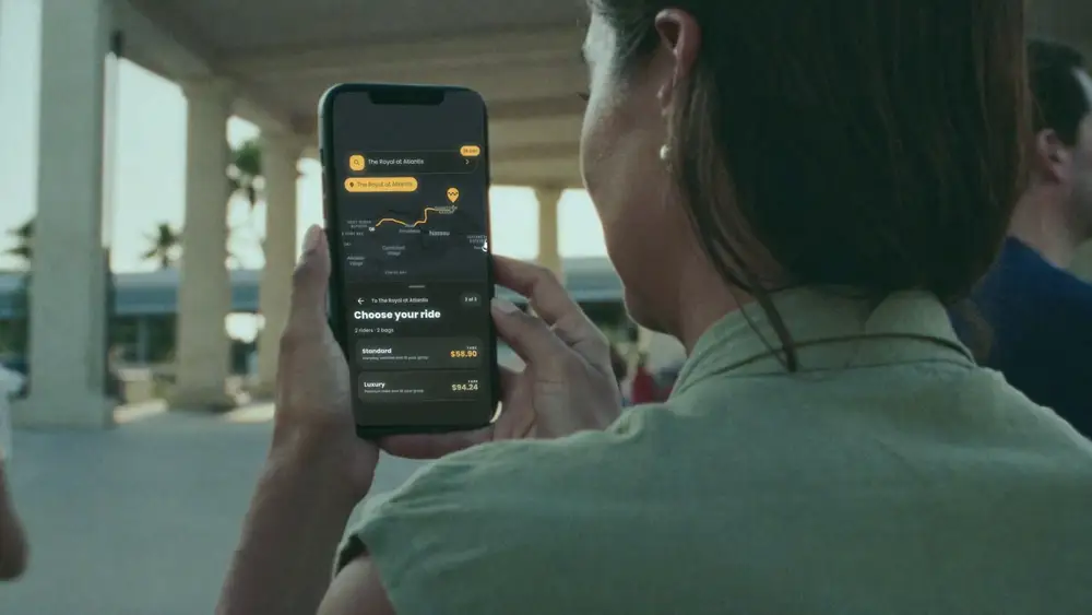 Rider holding the HOP app